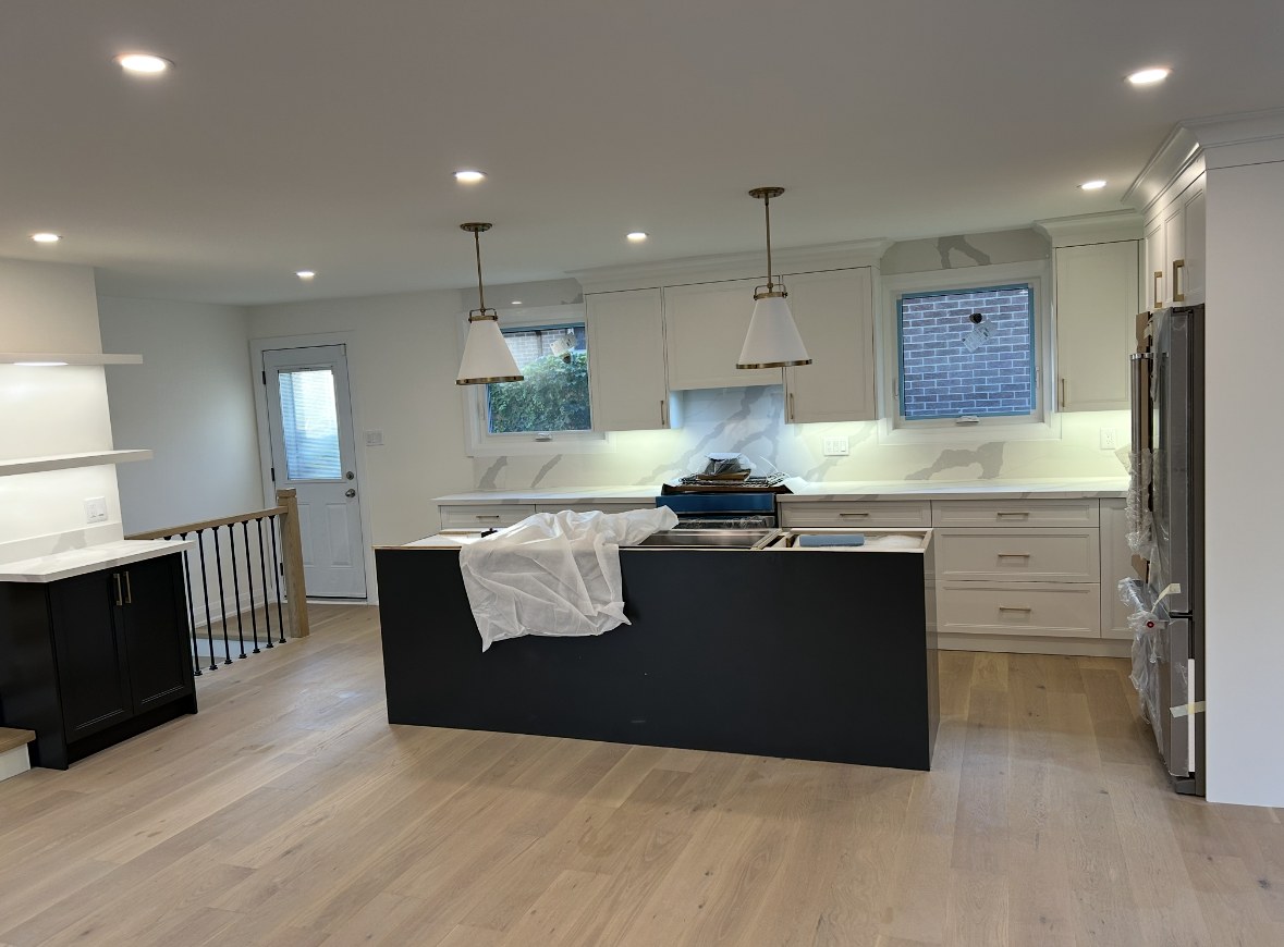 Chef style kitchen with gas range and marble backsplash